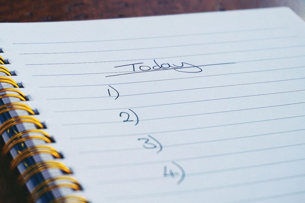 an open notebook with listed numbers and a word "Today" on top